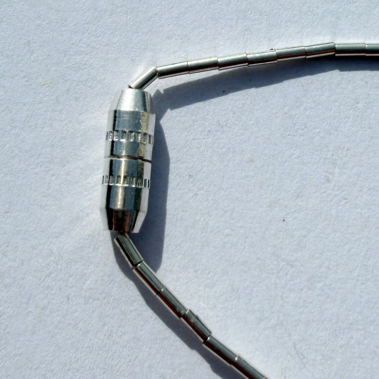 metal connector on a light gray background