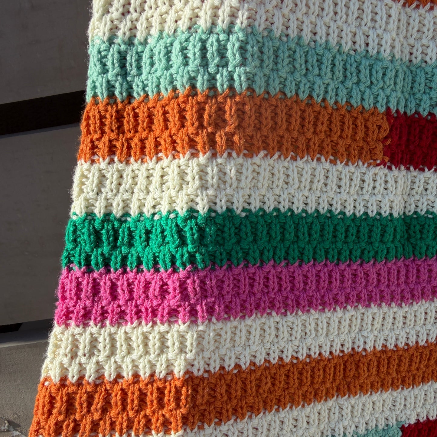 Multicolored striped fabric with a textured pattern