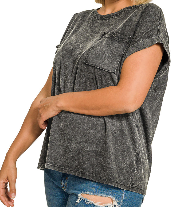 Woman wearing a gray acid-wash t-shirt on a white background