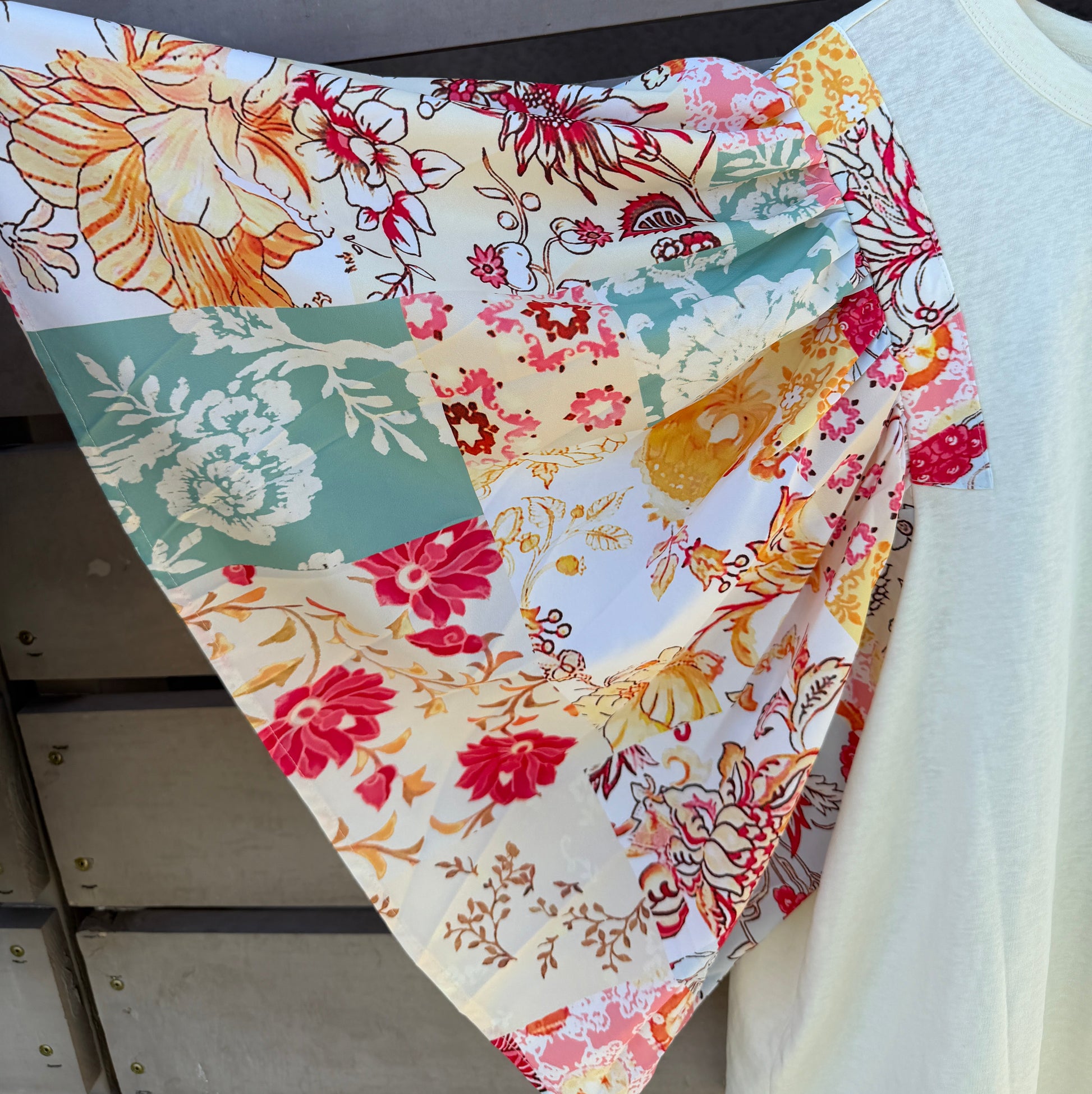 Colorful floral fabric on a wooden surface