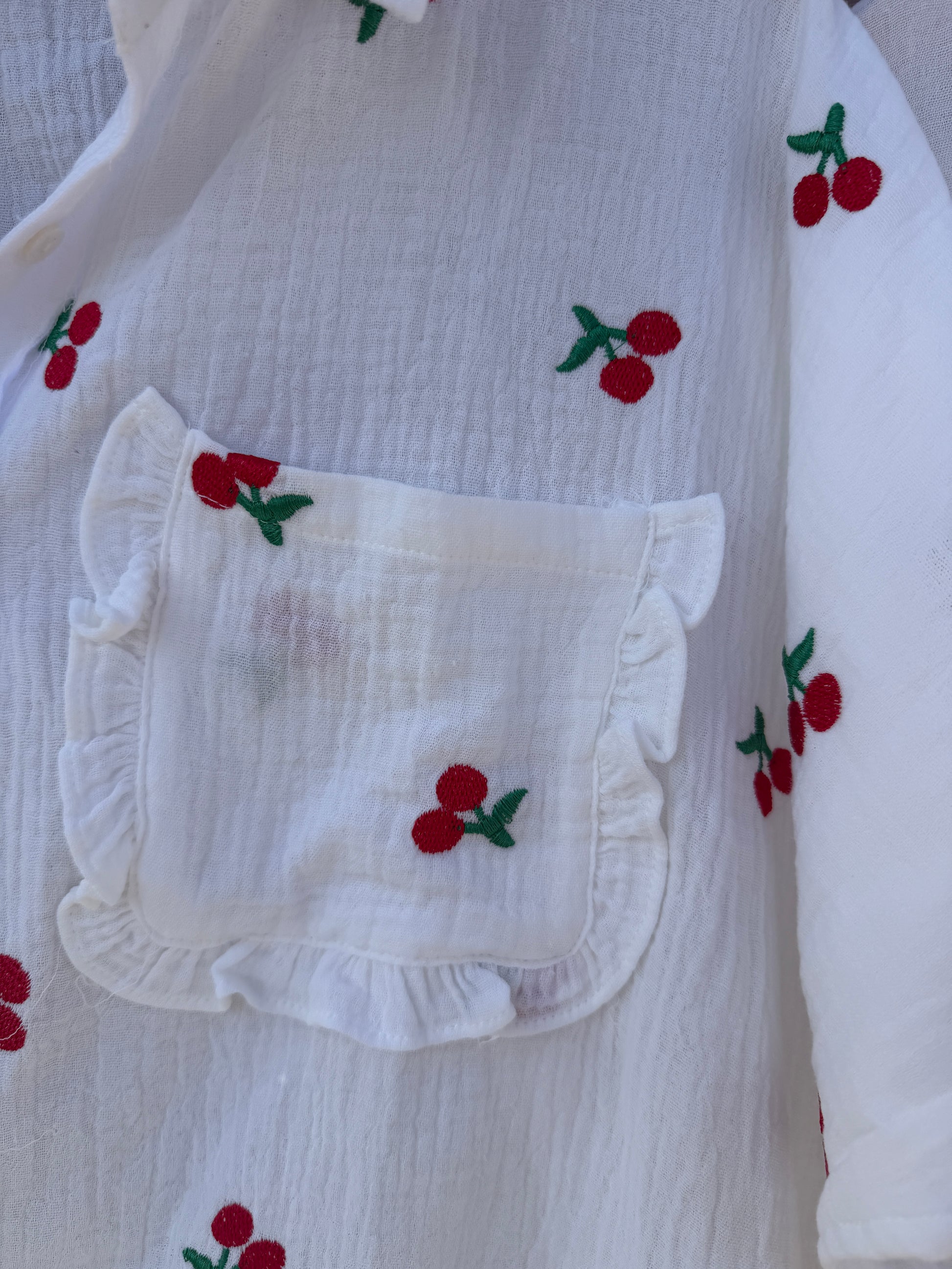White shirt with embroidered red cherries