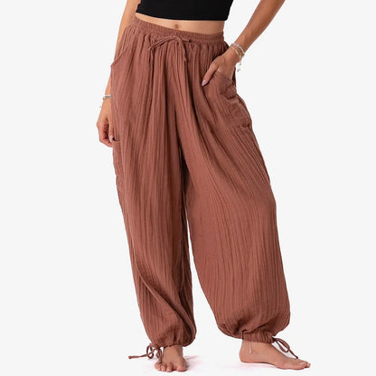 Brown wide-leg pants worn by a person on a white background