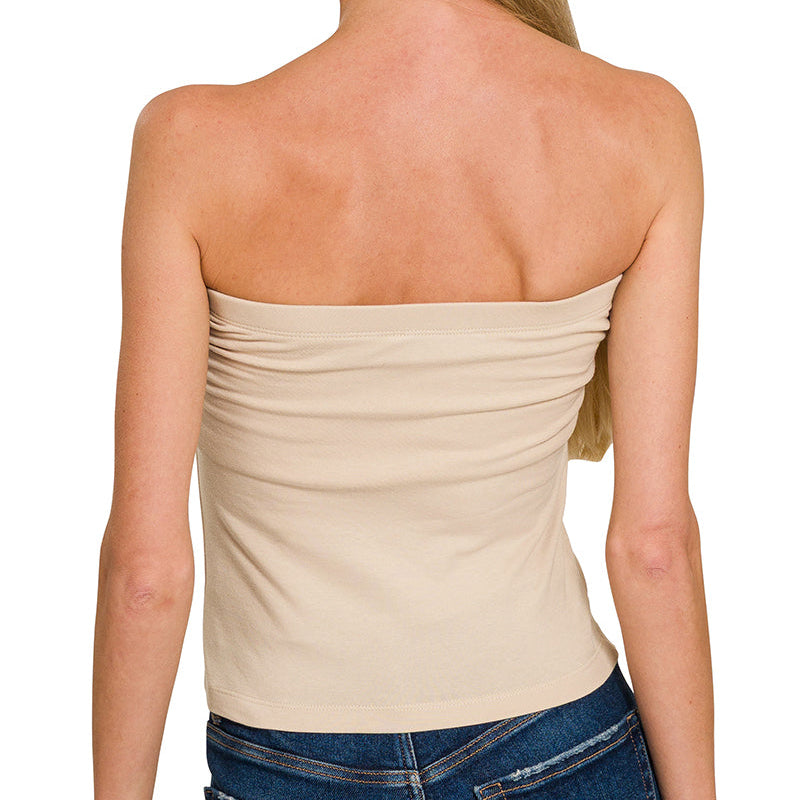 Woman wearing a strapless beige top
