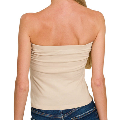 Woman wearing a strapless beige top