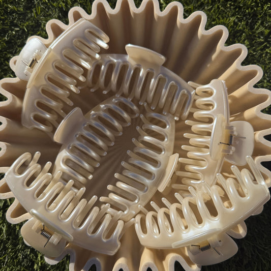 Close-up of a pearl claw clips