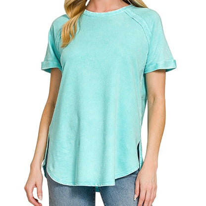 Person wearing a light blue t-shirt on a white background