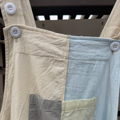 Close-up of patchwork with different colored fabric squares.