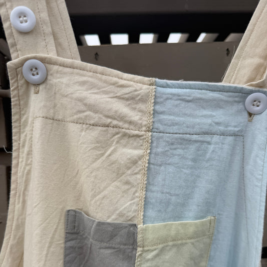 Close-up of patchwork with different colored fabric squares.