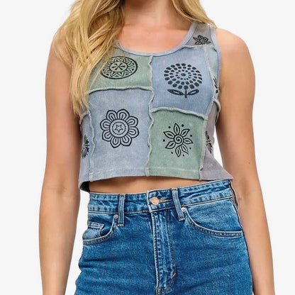 Woman wearing a patchwork denim crop top and high-waisted jeans on a white background