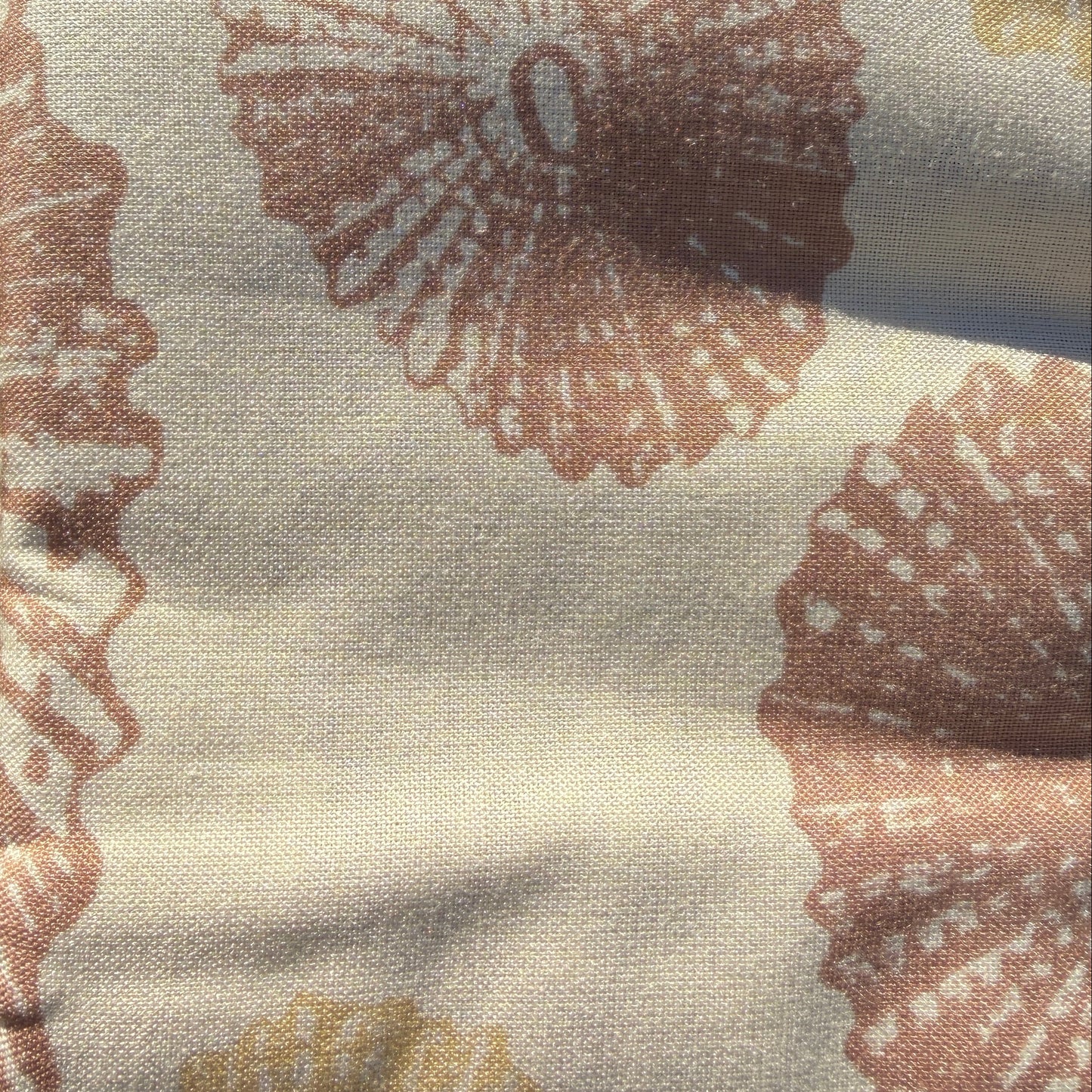 Fabric with shell pattern on grass
