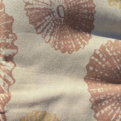 Fabric with shell pattern on grass