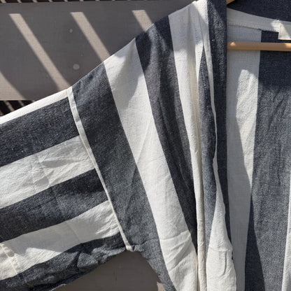 Black and white striped cover up on hanger