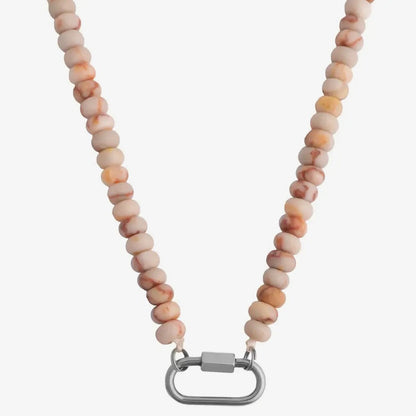 Necklace with beige beads and a silver clasp on a white background