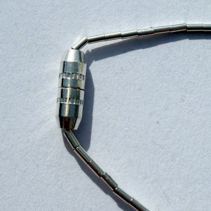 metal connector on a light gray background