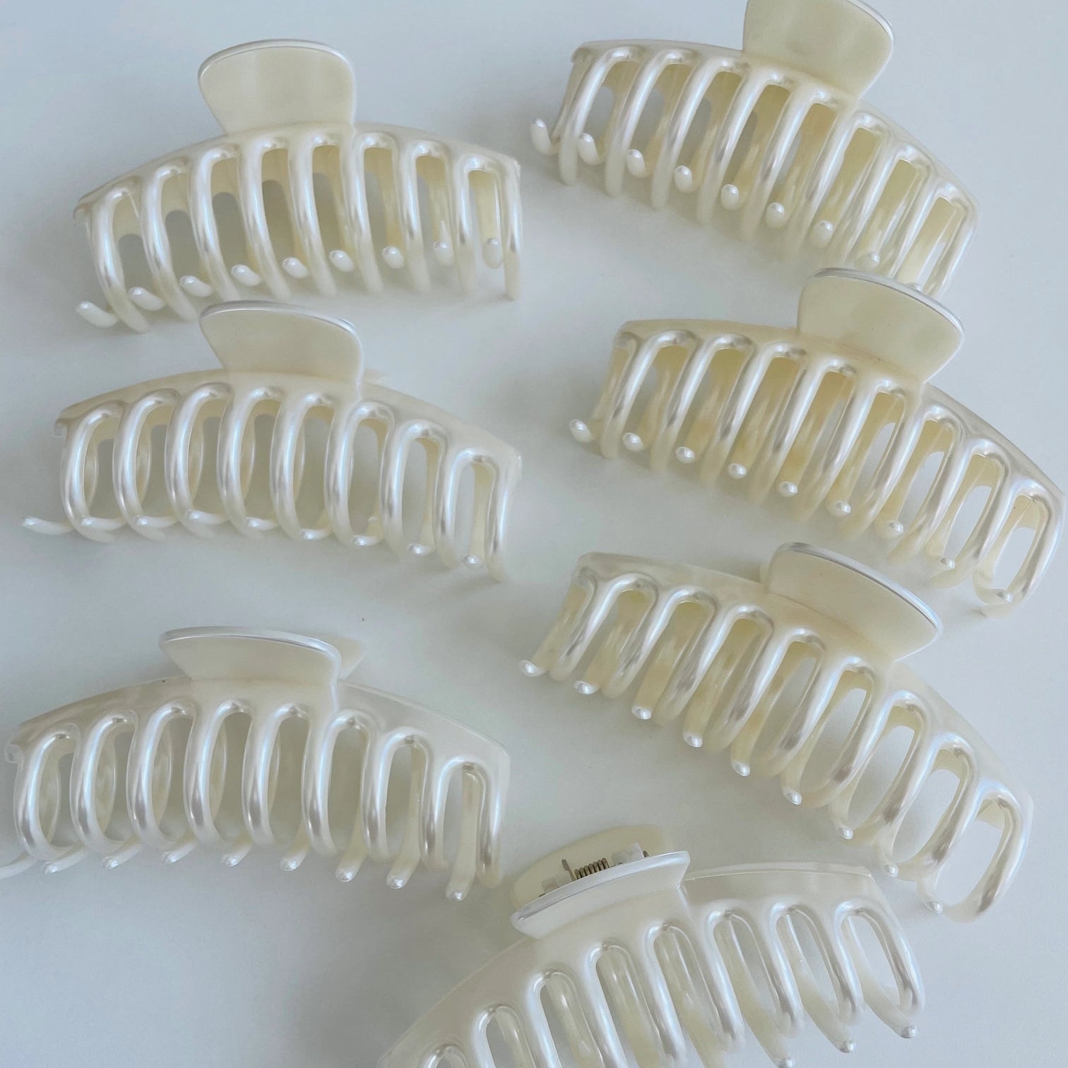 Set of pearl claw clips on a white background