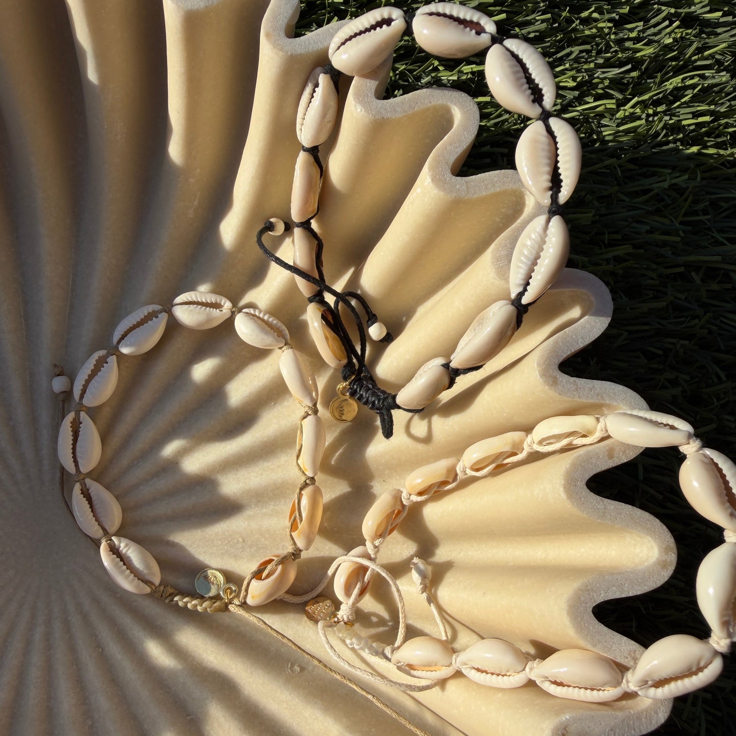 Decorative shell with bracelets draped over it