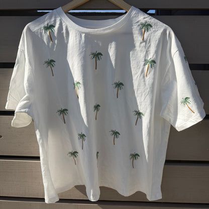 White t-shirt with palm tree patterns