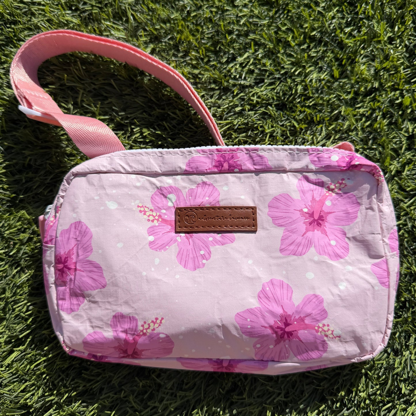 Floral-patterned pouch with a strap