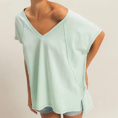 Light green sleeveless top worn by a person on a plain background