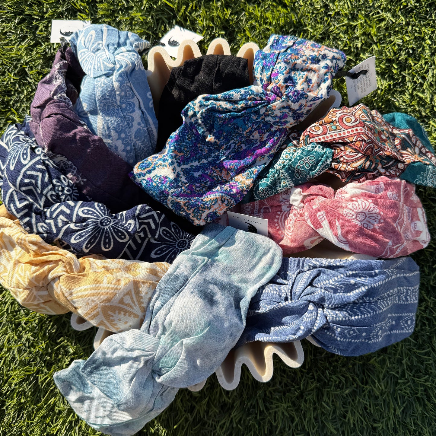 Collection of colorful hair ties on grass