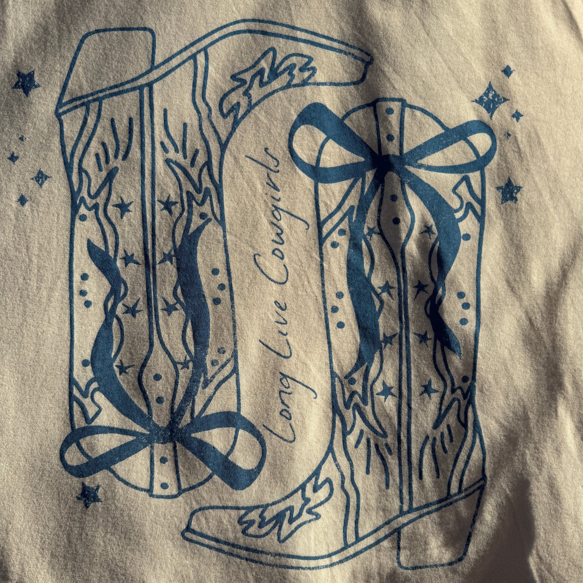 Decorative blue design on a beige fabric background