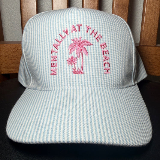 Cap with pink text and palm tree design