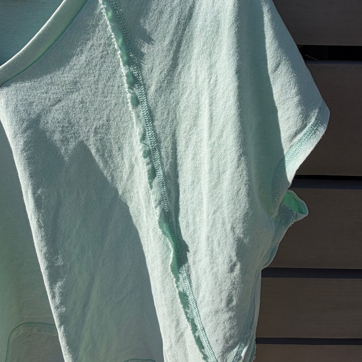 green shirt on hanger