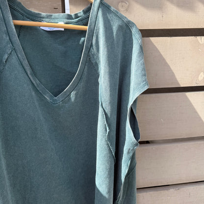 Dark teal shirt on hanger