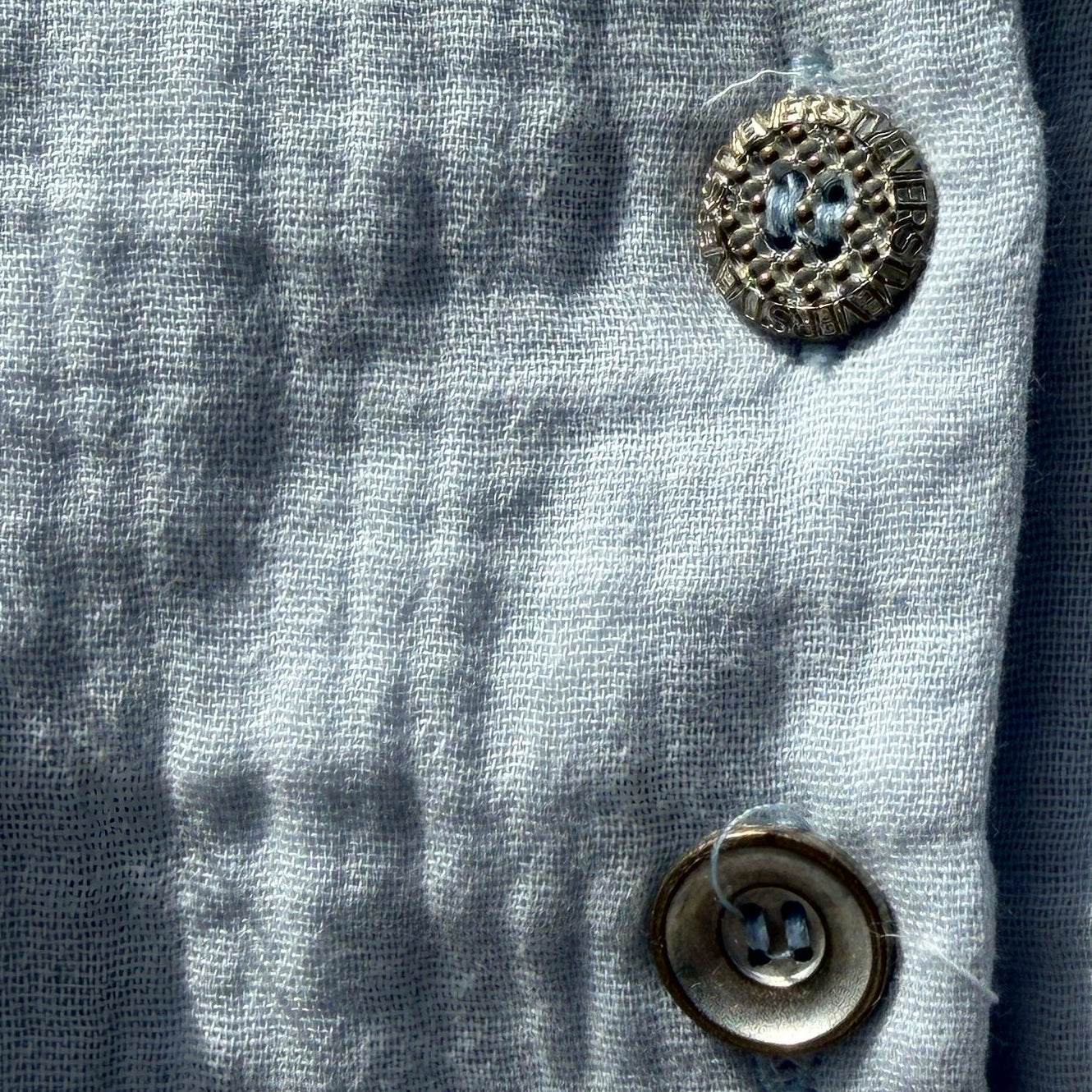 Close-up of a blue fabric with buttons