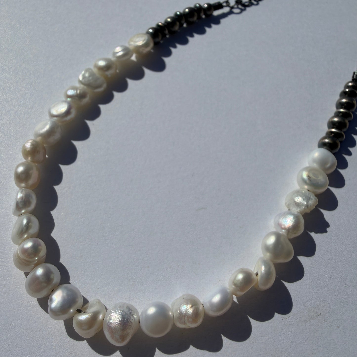 Pearl necklace on a white background