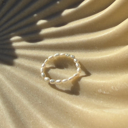 Pearl ring in beige bowl