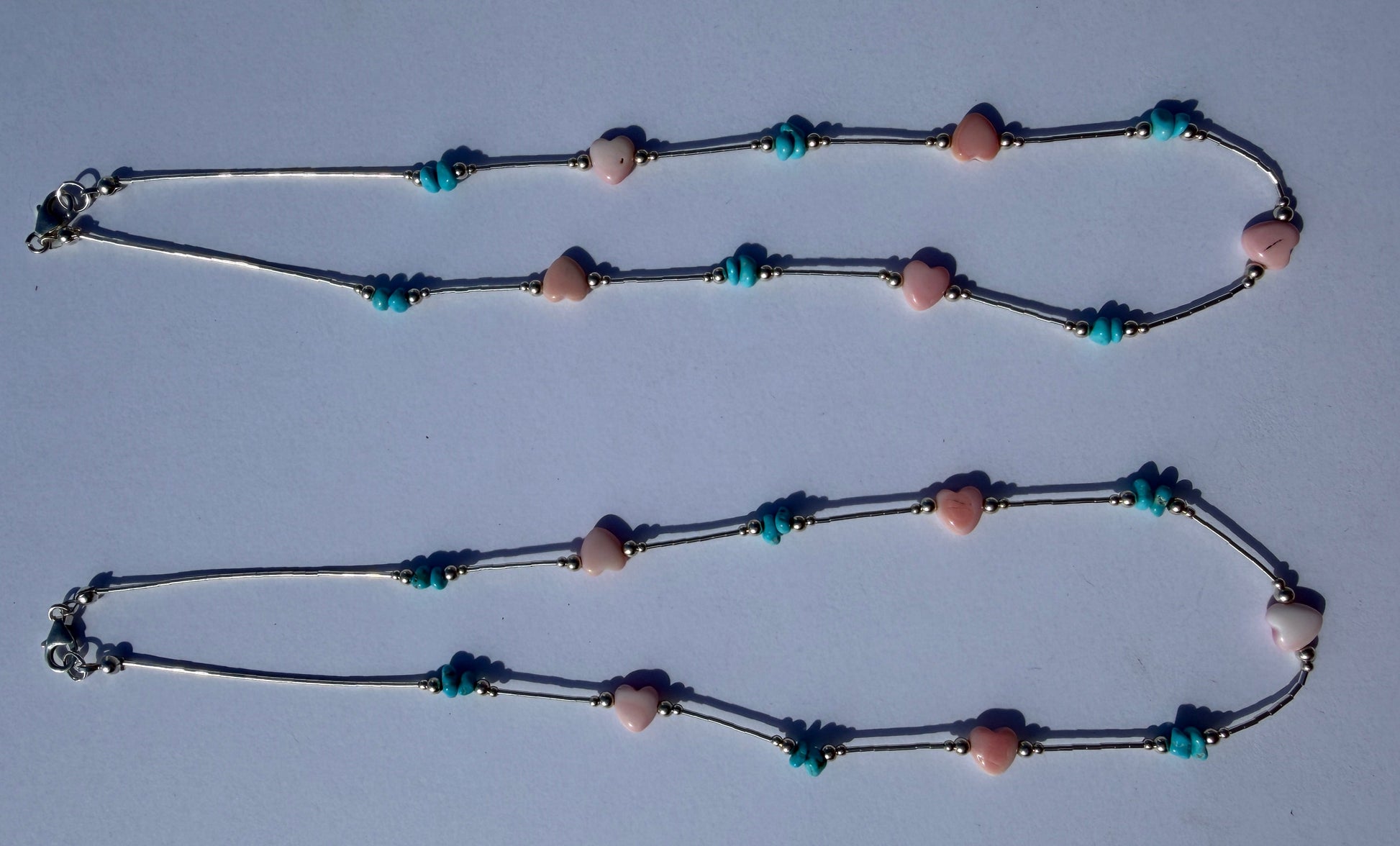 Necklace with beads on a light gray background