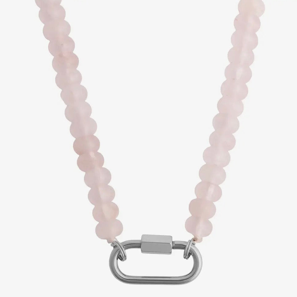 Necklace with pink beads and a silver clasp on a white background