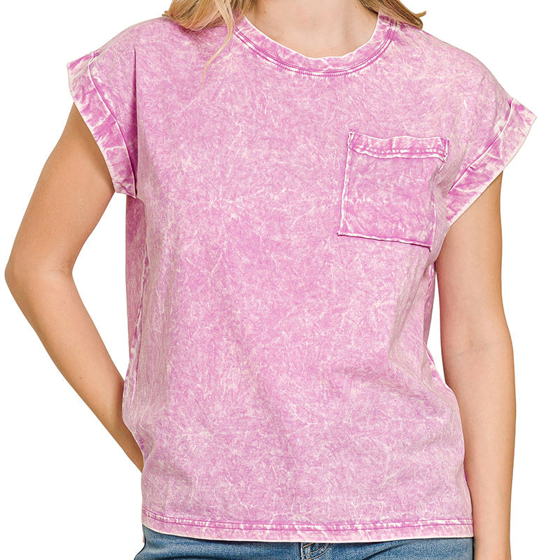 Woman wearing a pink acid-wash t-shirt with a pocket on a white background