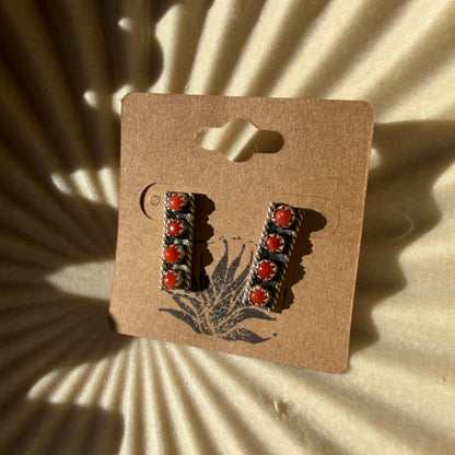 earrings on beige background