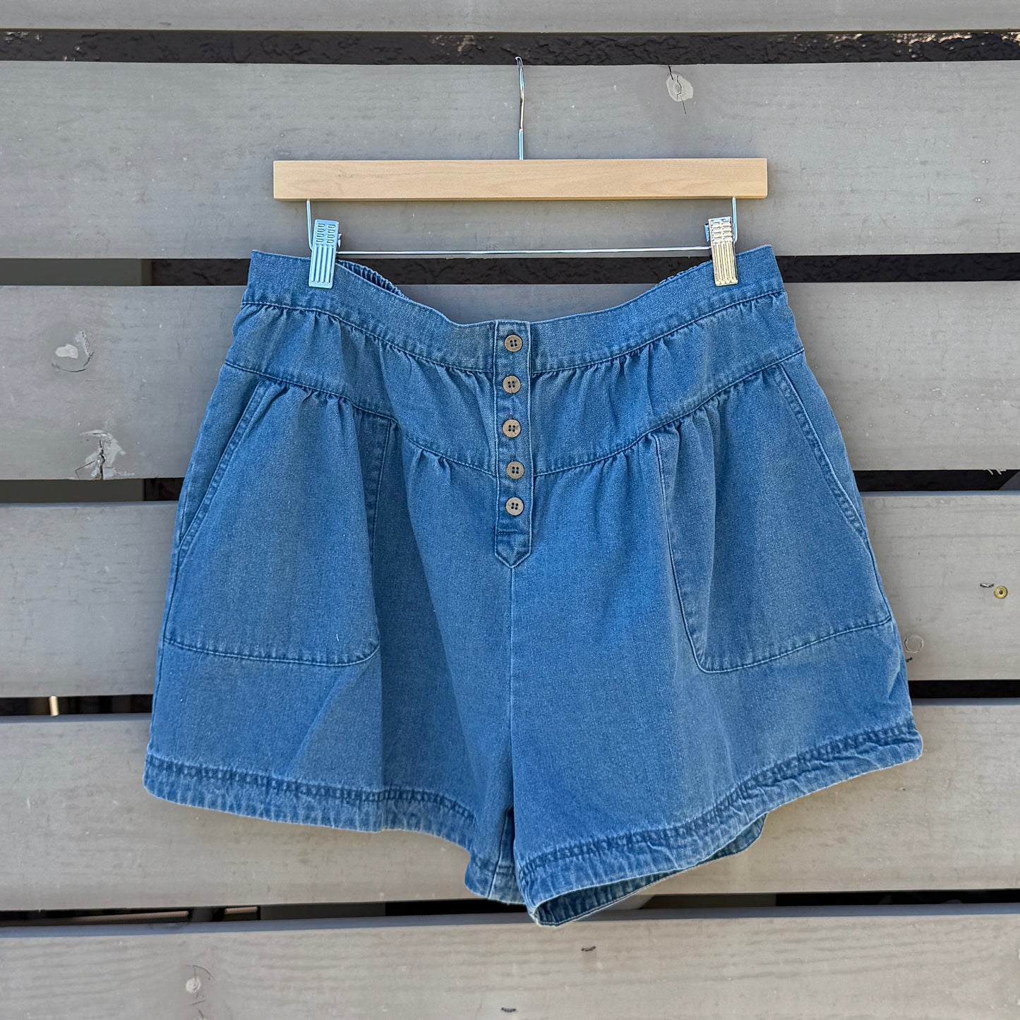 Blue denim shorts on a wooden deck