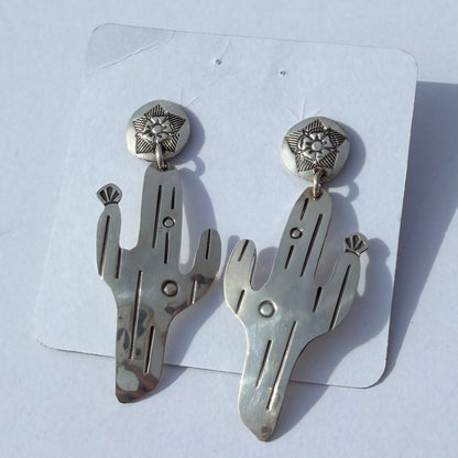 Silver earrings on a white background