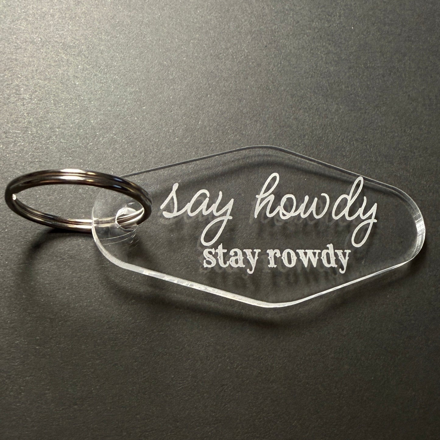 Clear keychain with 'Stay Rowdy' text on a dark gray background
