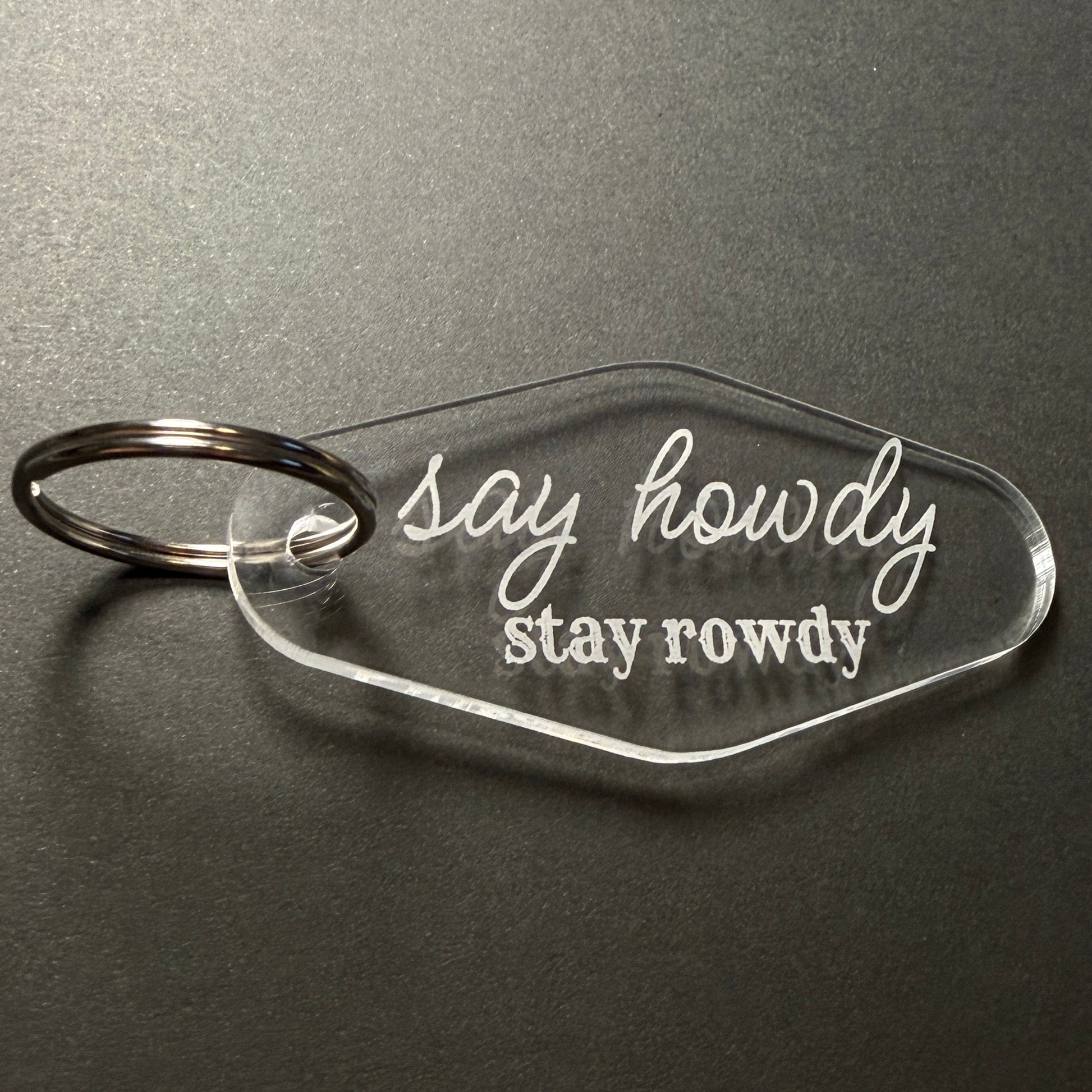 Clear keychain with 'Stay Rowdy' text on a dark gray background