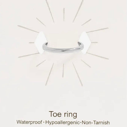 Silver toe ring on a white card