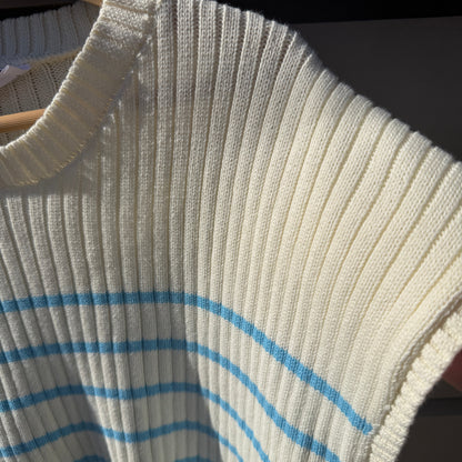 Close-up of a textured fabric with blue lines on a dark background