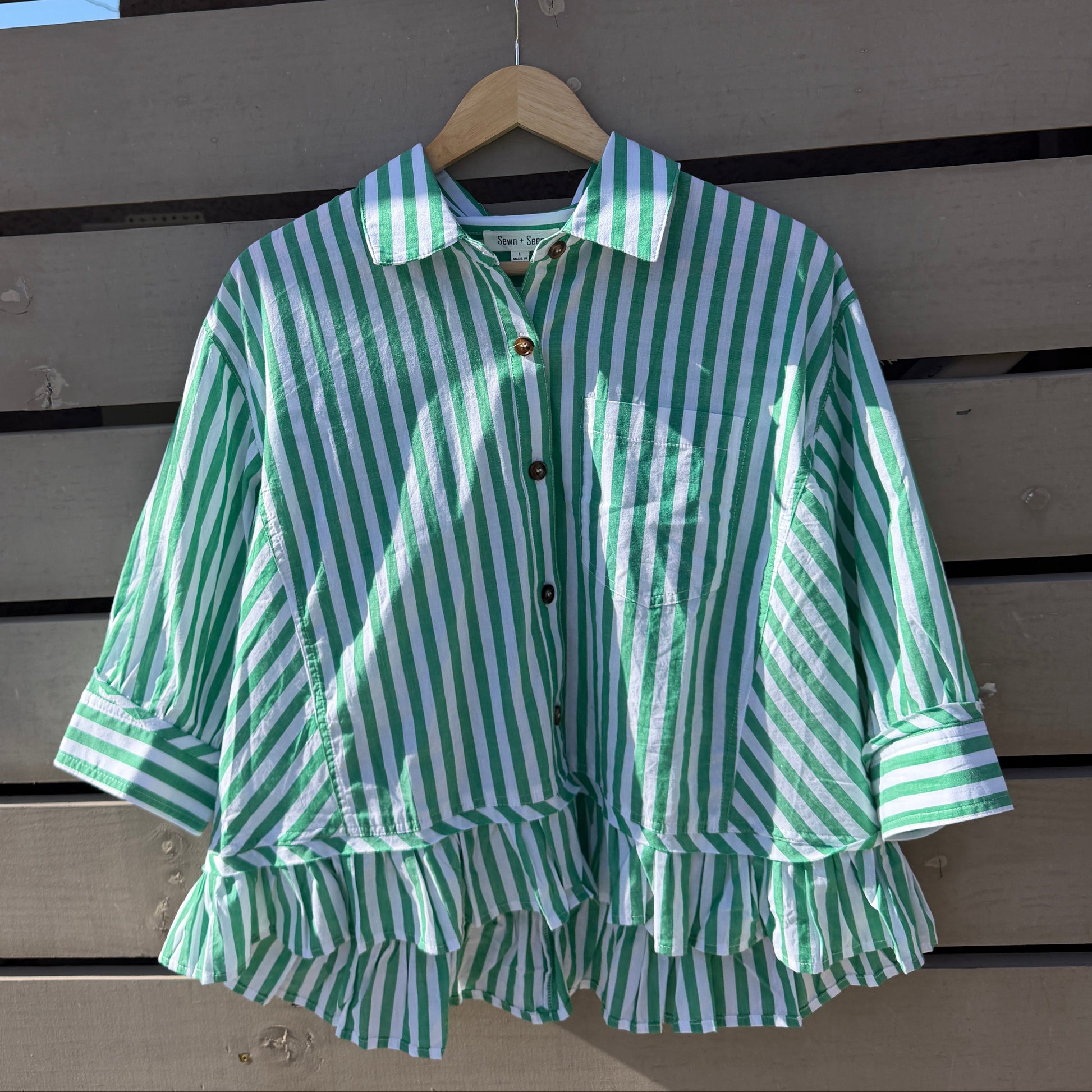 Green and white striped shirt