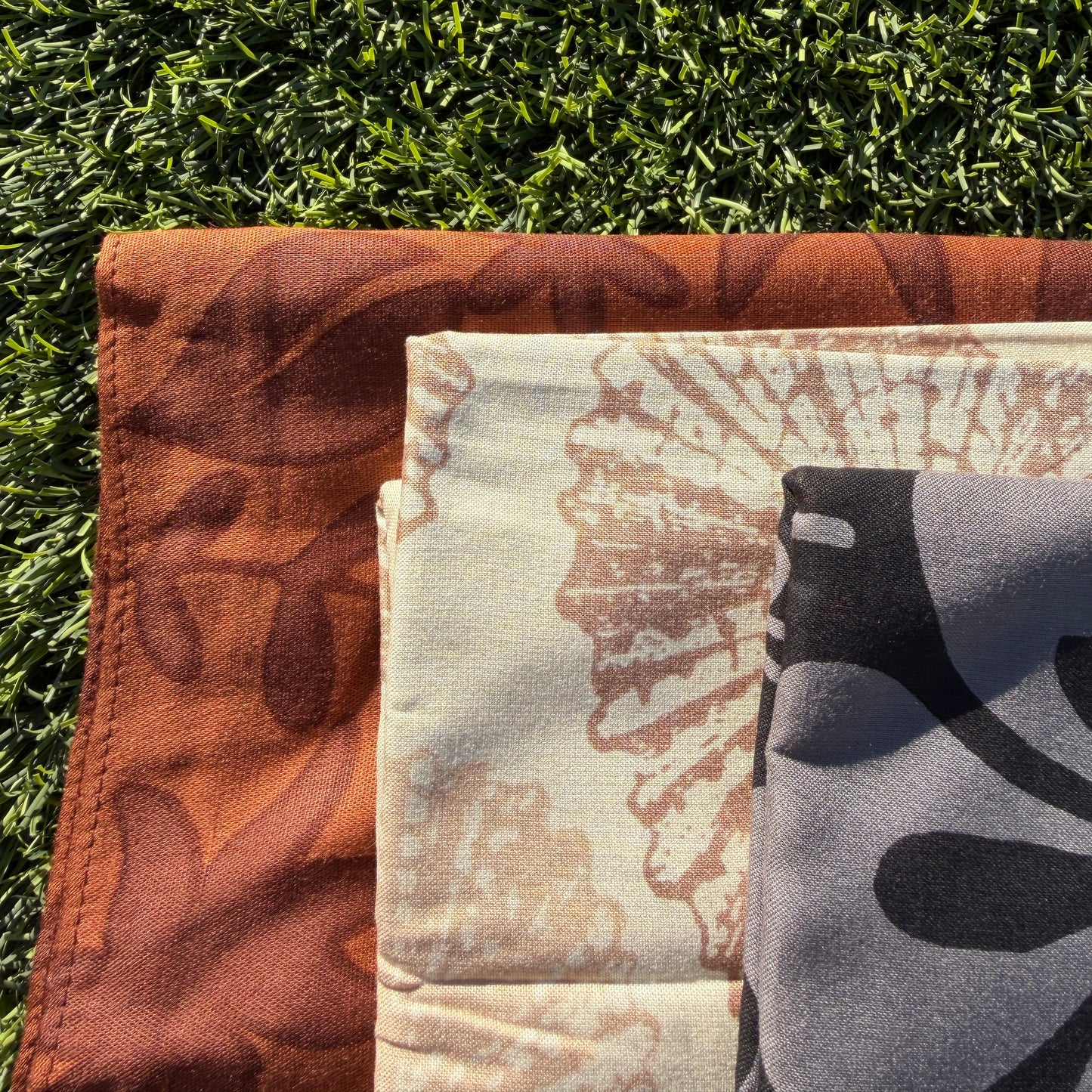 Close-up of a patterned fabric on grass