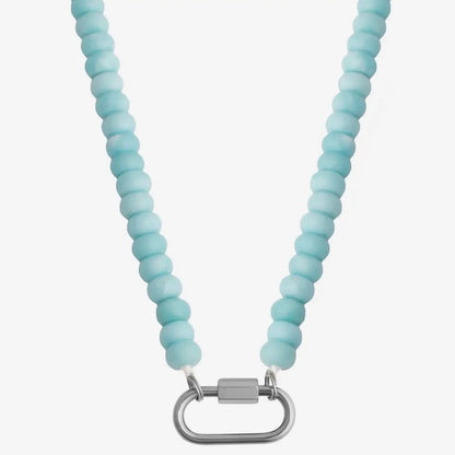 Light blue beaded necklace with a silver clasp on a white background